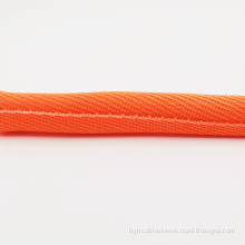 Impact resistant self-winding braided sleeve